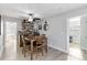 Well-lit living area featuring a dining table and a liquor cabinet at 6001 Firefly Ln, Apollo Beach, FL 33572