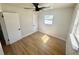 Comfortable bedroom with modern ceiling fan, white trim, and wood-look flooring at 6226 21St N Ave, St Petersburg, FL 33710