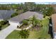 Aerial view of single-Gathering home showcasing roof, landscaping and neighborhood at 6373 Royal Tern Cir, Lakewood Ranch, FL 34202