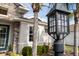 Close up of exterior lighting fixture with a partial home view at 6373 Royal Tern Cir, Bradenton, FL 34202