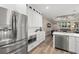 Modern kitchen featuring stainless steel refrigerator, white cabinets, and a convenient microwave oven at 6373 Royal Tern Cir, Lakewood Ranch, FL 34202