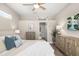 Bright main bedroom boasts a ceiling fan and neutral tones and two dressers at 6373 Royal Tern Cir, Lakewood Ranch, FL 34202