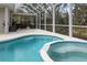 Inviting screened-in pool and spa with a charming patio area at 6373 Royal Tern Cir, Bradenton, FL 34202