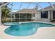 Inviting screened-in pool and spa with a charming patio area at 6373 Royal Tern Cir, Bradenton, FL 34202