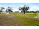 Community soccer field with well-maintained green grass and trees in the background at 6373 Royal Tern Cir, Bradenton, FL 34202