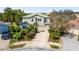 An aerial view of this two-story home with a two-car garage and beautiful tropical landscaping at 6807 46Th E Ter, Bradenton, FL 34203