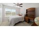 Bedroom featuring a ceiling fan, study desk, and a bright window at 6807 46Th E Ter, Bradenton, FL 34203