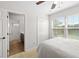 Bedroom featuring a window and a view into an en-suite bathroom at 6807 46Th E Ter, Bradenton, FL 34203