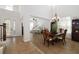 Open concept entryway with a piano next to a formal dining room at 6807 46Th E Ter, Bradenton, FL 34203