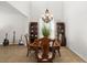 Dining room features a hanging light fixture with tile flooring and neutral paint at 6807 46Th E Ter, Bradenton, FL 34203