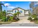 Stunning two-story home featuring lush landscaping and a neutral color palette at 6807 46Th E Ter, Bradenton, FL 34203