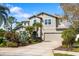 Charming two-story home featuring a two-car garage, lush landscaping, and a neutral color palette at 6807 46Th E Ter, Bradenton, FL 34203