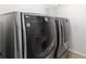 Modern laundry room with front-loading washer and dryer for convenience at 6807 46Th E Ter, Bradenton, FL 34203