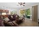 Relaxing living room with sliding glass doors leading to a covered patio and pool area at 6807 46Th E Ter, Bradenton, FL 34203