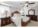 Relaxing main bedroom featuring a wood bed frame, side tables with lamps, and serene decor at 6807 46Th E Ter, Bradenton, FL 34203