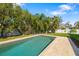 Backyard pool with lush landscaping and room for entertaining at 6807 46Th E Ter, Bradenton, FL 34203