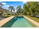 Backyard pool with well-maintained landscaping, perfect for relaxing and entertaining at 6807 46Th E Ter, Bradenton, FL 34203