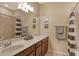 Bathroom featuring a single sink vanity and shower with neutral tones at 7212 Ketch Pl, Bradenton, FL 34212