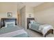 Bright bedroom featuring two twin beds with wood frames and light green bedding at 7212 Ketch Pl, Bradenton, FL 34212