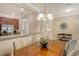 Open-concept dining area featuring stainless steel appliances, and granite counters at 7212 Ketch Pl, Bradenton, FL 34212