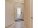 Inviting entryway with decorative glass door and neutral tile flooring at 7212 Ketch Pl, Bradenton, FL 34212