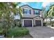 Charming two-story home with a two-car garage and lush landscaping at 7212 Ketch Pl, Bradenton, FL 34212