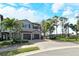 Beautiful townhouse featuring a two-car garage, mature landscaping, and a tile roof in a desirable community at 7212 Ketch Pl, Bradenton, FL 34212