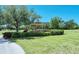 Picturesque gazebo nestled in a green landscape with manicured bushes and mature shade trees in a park-like setting at 7212 Ketch Pl, Bradenton, FL 34212