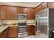 Well-equipped kitchen featuring stainless steel appliances and granite countertops at 7212 Ketch Pl, Bradenton, FL 34212