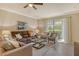 Bright and airy living room with large windows and comfortable seating at 7212 Ketch Pl, Bradenton, FL 34212