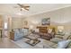 Inviting living room with neutral tones, ceiling fan, and comfortable seating arrangement at 7212 Ketch Pl, Bradenton, FL 34212