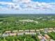 Aerial view of townhouses nestled in a wooded area at 7350 Black Walnut Way, Lakewood Ranch, FL 34202