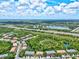 Aerial view of townhouses and lush green landscape at 7350 Black Walnut Way, Lakewood Ranch, FL 34202