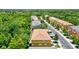 Aerial view of townhouses and street lined with trees at 7350 Black Walnut Way, Lakewood Ranch, FL 34202