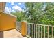 Peaceful balcony with scenic wooded views and a bright sunny day at 7350 Black Walnut Way, Lakewood Ranch, FL 34202