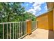 Spacious balcony overlooking lush green trees and a beautiful sky at 7350 Black Walnut Way, Lakewood Ranch, FL 34202