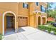 Townhome's front entrance and two-car garage at 7350 Black Walnut Way, Lakewood Ranch, FL 34202