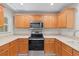 Modern kitchen with stainless steel appliances and ample counter space at 7350 Black Walnut Way, Lakewood Ranch, FL 34202