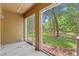 Screened patio overlooking a tranquil pond and lush greenery at 7350 Black Walnut Way, Lakewood Ranch, FL 34202