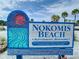 Close-up of the Nokomis Beach sign with beach details, operated by Sarasota County at 779 Fordingbridge Way, Osprey, FL 34229