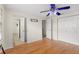 Bedroom with ceiling fan and wood floors at 7805 Capwood Ave, Temple Terrace, FL 33637