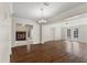 Bright dining room with hardwood floors and views into Gathering room and kitchen at 7805 Capwood Ave, Temple Terrace, FL 33637