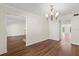 Formal dining room with hardwood floors and chandelier at 7805 Capwood Ave, Temple Terrace, FL 33637