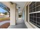 Side view of the porch showing a light blue door and windows at 7805 Capwood Ave, Temple Terrace, FL 33637