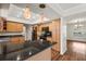 Modern kitchen with light wood cabinets and granite countertops at 7805 Capwood Ave, Temple Terrace, FL 33637