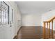 Living room with hardwood floors and staircase at 7805 Capwood Ave, Temple Terrace, FL 33637