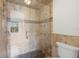 Large walk-in shower with stone tile and multiple shower heads at 7805 Capwood Ave, Temple Terrace, FL 33637