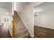 Staircase with wooden railing leading to the second floor at 7805 Capwood Ave, Temple Terrace, FL 33637