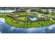 Community pool and cabana with lush landscaping at 8437 Skye Ranch Blvd, Sarasota, FL 34241