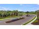 Cassia at Skye Ranch entrance with lush landscaping at 8437 Skye Ranch Blvd, Sarasota, FL 34241